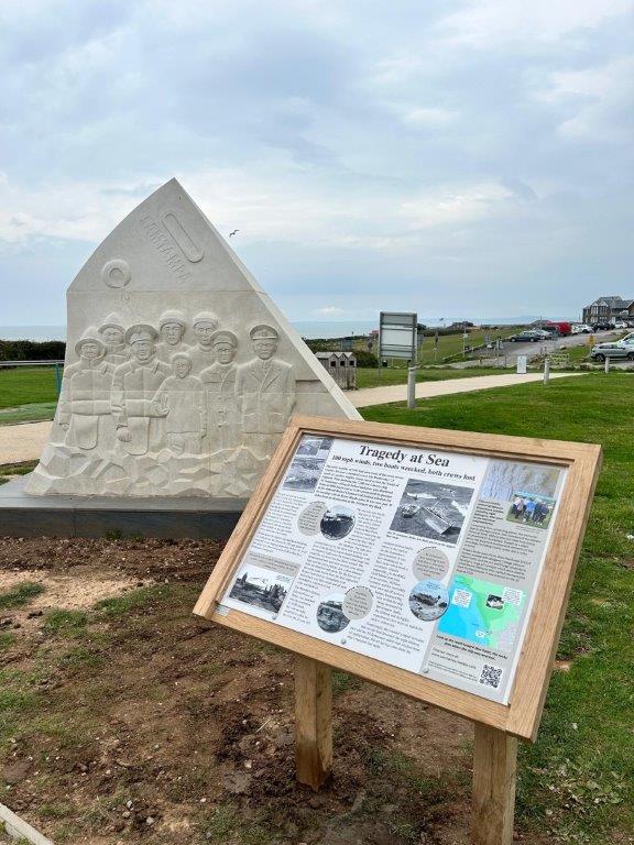 The seven ton memorial at Rest Bay, Porthcawl, and the information board alongside it.