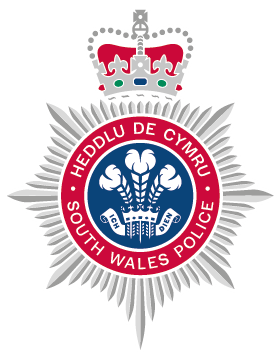 South Wales Police crest.