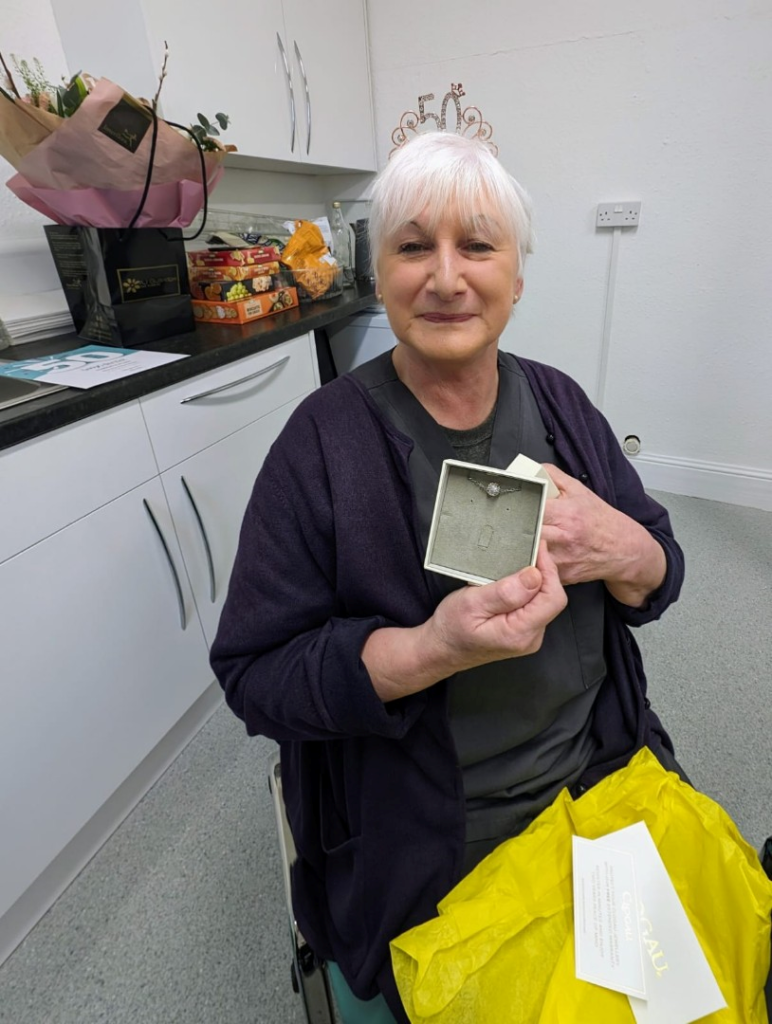 Norma Clements and her gifts from the team. 