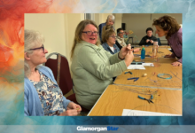 Crafters at work during an art group meeting.