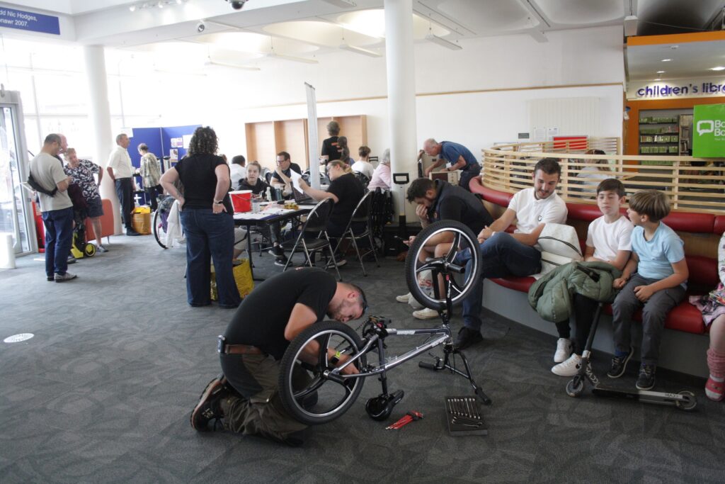 Working on a bike at the Repair Café.