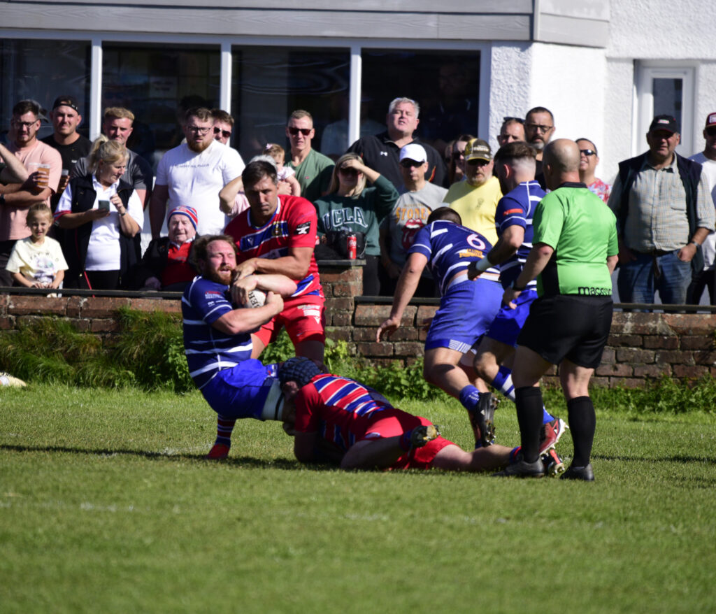 Gavin wrestles for the ball as Heol-y-Cyw attack. Photo: Julie Hancock.