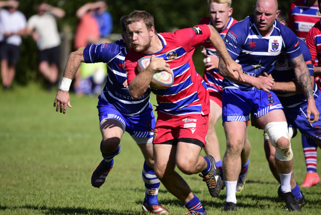 Tom Geere makes a break for Pencoed. Photo: Julie Hancock.