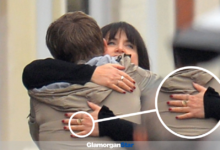 Oscar Hartland and in character Ruth Jones seen hugging outside Gwen’s house - but Nessa’s hand shows no engagement or wedding rings. Photo: WALES NEWS SERVICE.