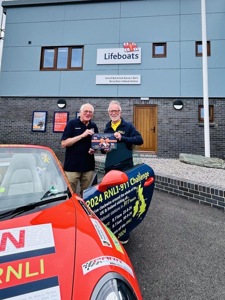 James Richardson presenting a 200th Anniversary 911 Challenge jigsaw to Stuart McMillan, Chair of Barry Dock Lifeboat Station. Photo: RNLI/Lisa Newberry.