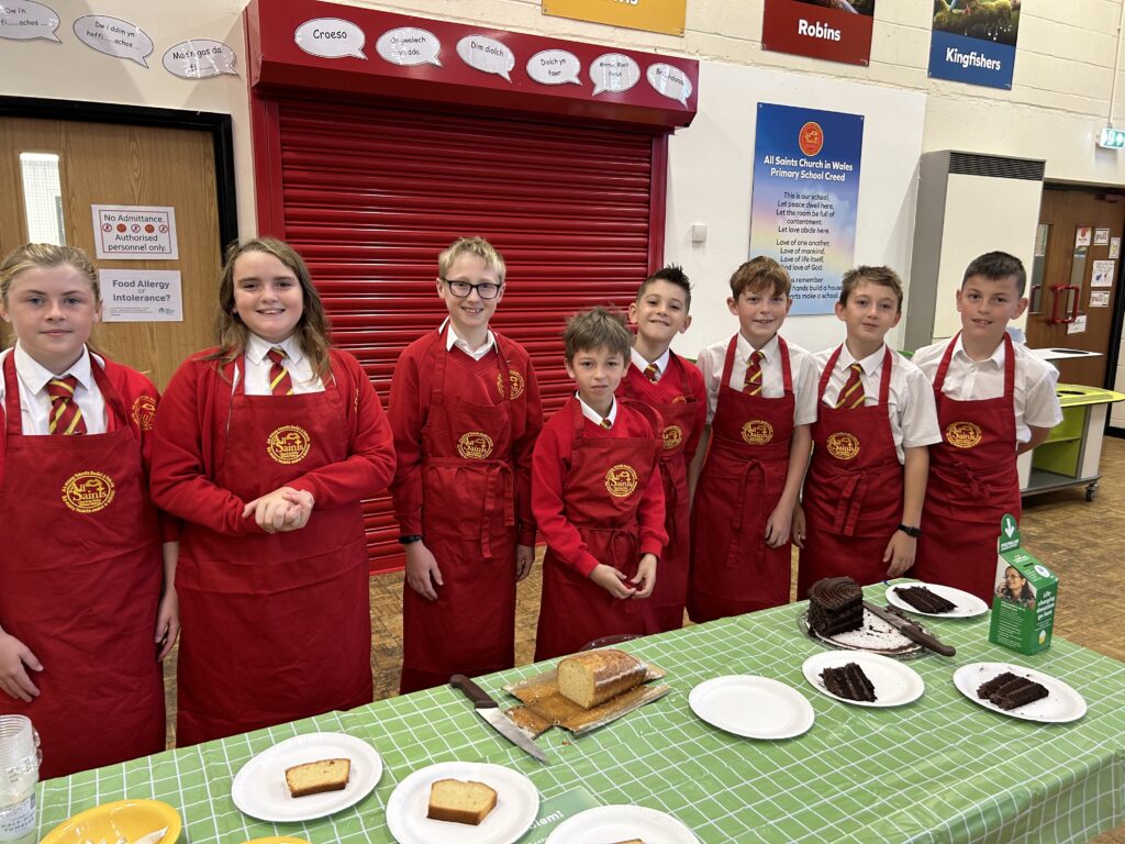 The school ambassadors were serving cake.
