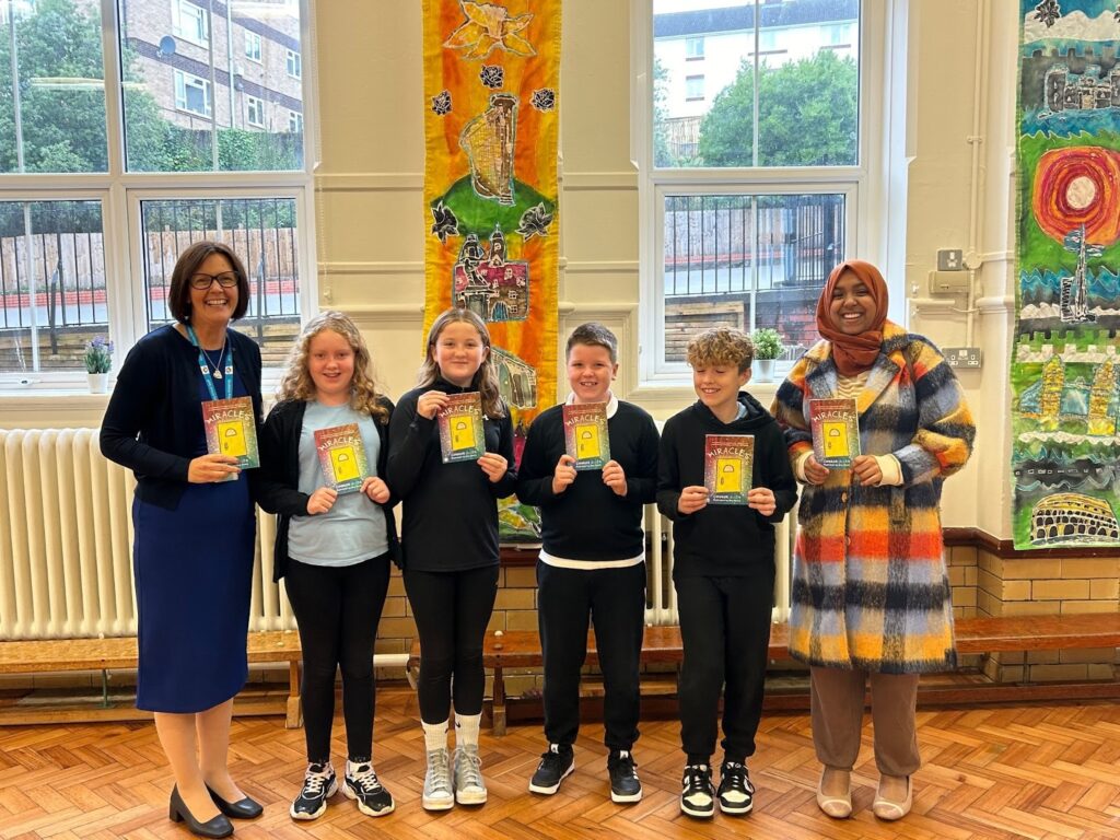 Headteacher Mrs Ellis, the Gladstone Senedd Committee and Jannat Ahmed (on right).
