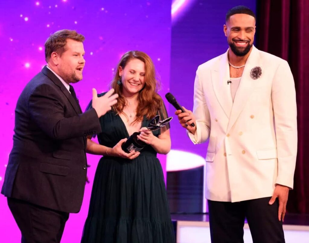 Molly receiving her Pride of Britain award from Ashley Banjo and James Corden.
