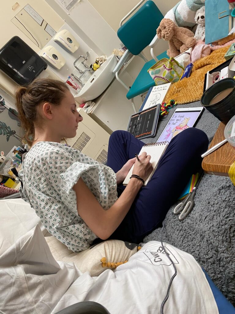 Molly, unwell in hospital, doing what she loves - crafting.