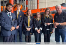 Stanwell School sixth form pupils presenting a £2,000 cheque to the chairman of Penarth RNLI, Laurie Pavelin.