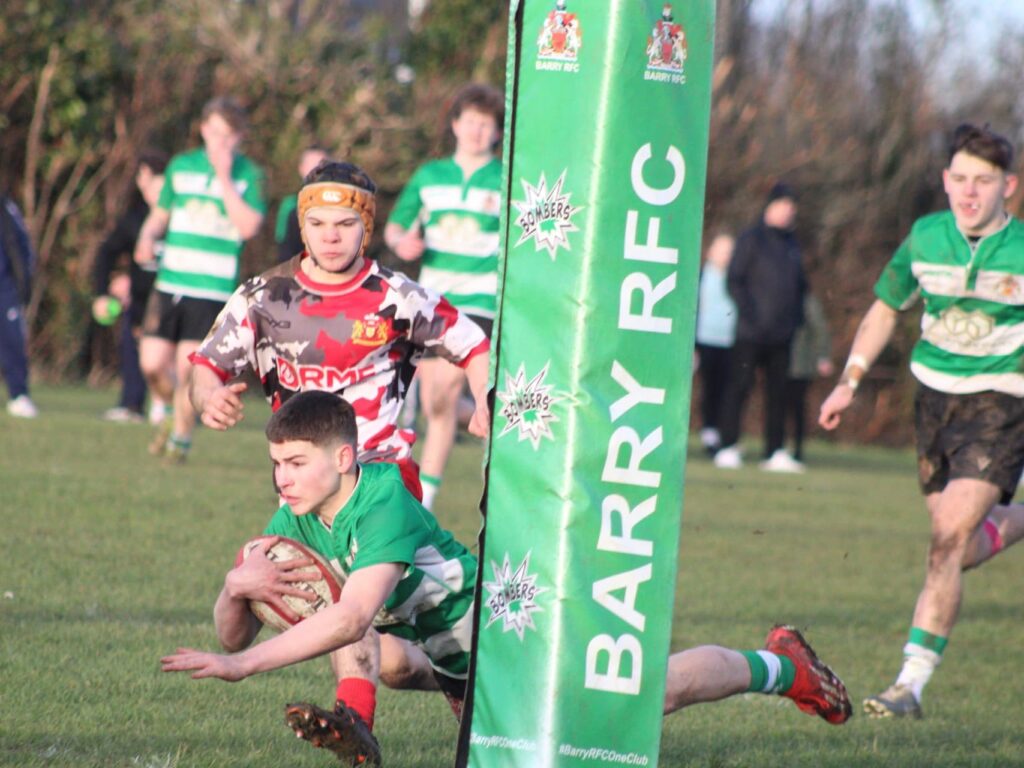 Morgan Beasley goes over near the posts for a try. Photo by Judith Dutton.