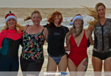 Braving the cold water are (left to right): Emma Harrison-Kemp; Sharon Boult; Carys Lewis; Rhiannon Collins and Magdalena Maklakiewicz- Evans.