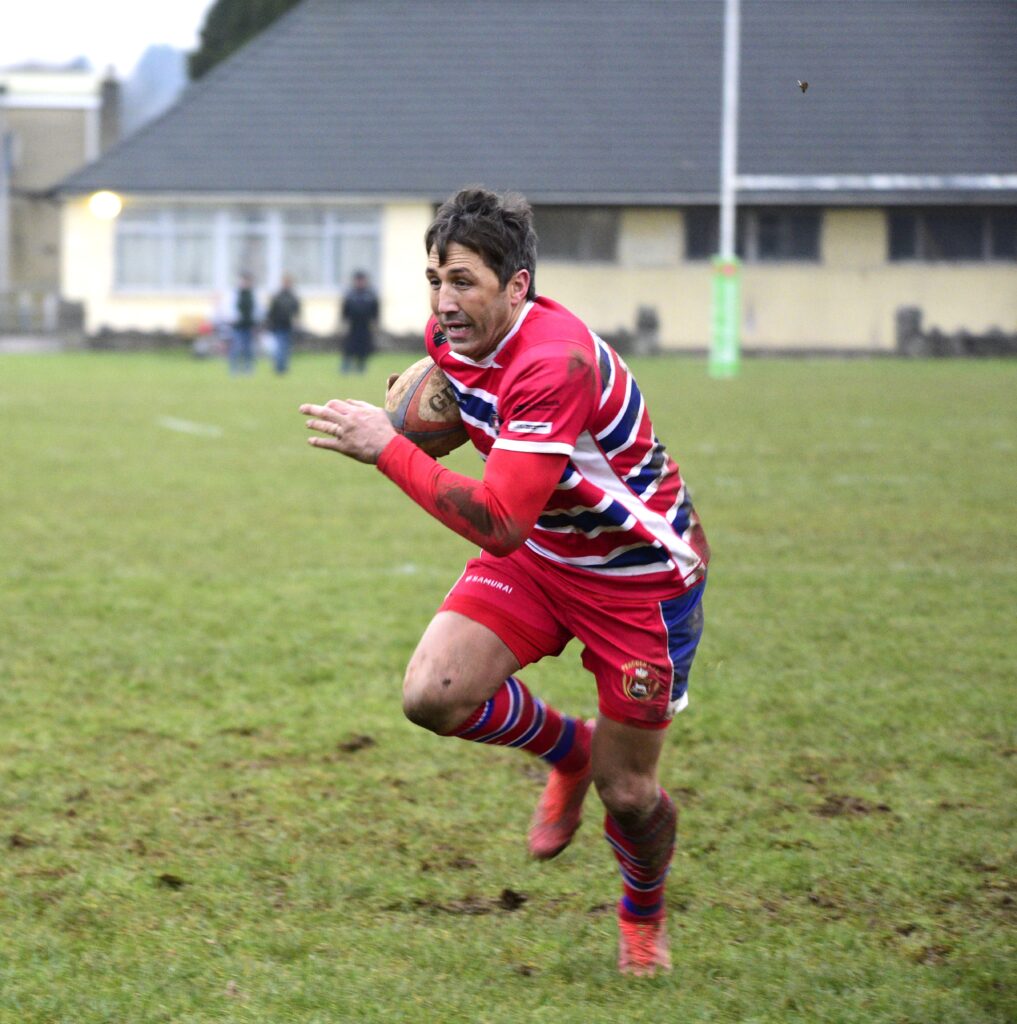 Gavin Henson spots a gap to score a crucial late try.