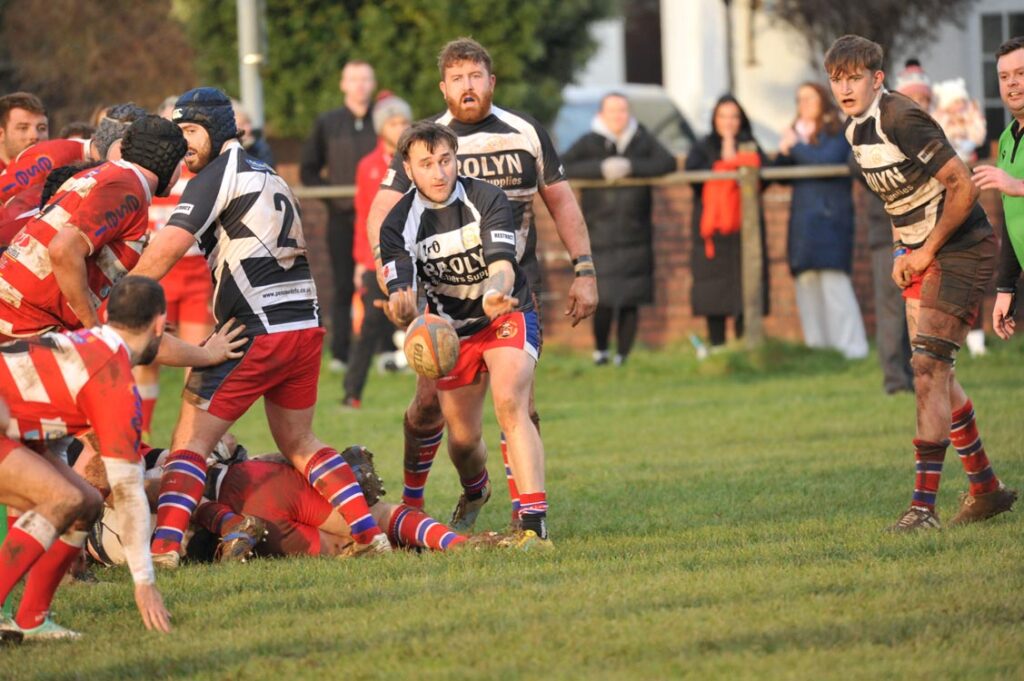 Pencoed scrum half Brandon Mullen sets the backs in motion.
