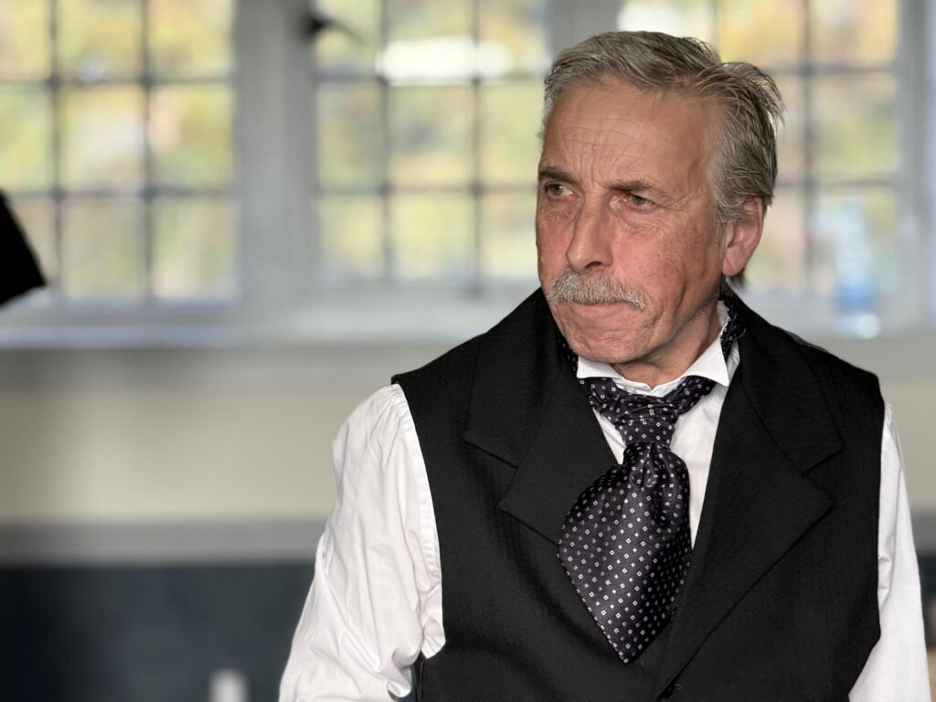 Llion Williams as David Lloyd George.