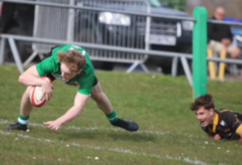 Tyler Reinholdt evades a tackle to score. Photo by Judith Dutton.