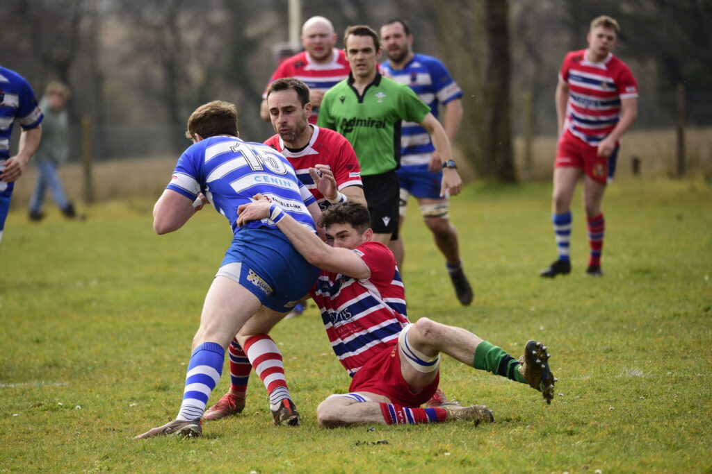 Wil Hurley and Aaron Songhurst tackling for Pencoed.