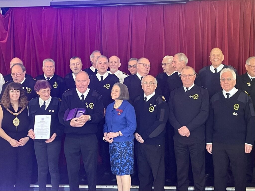 Volunteers with the Deputy Lord Lieutenant Bet Davies at the award presentation.