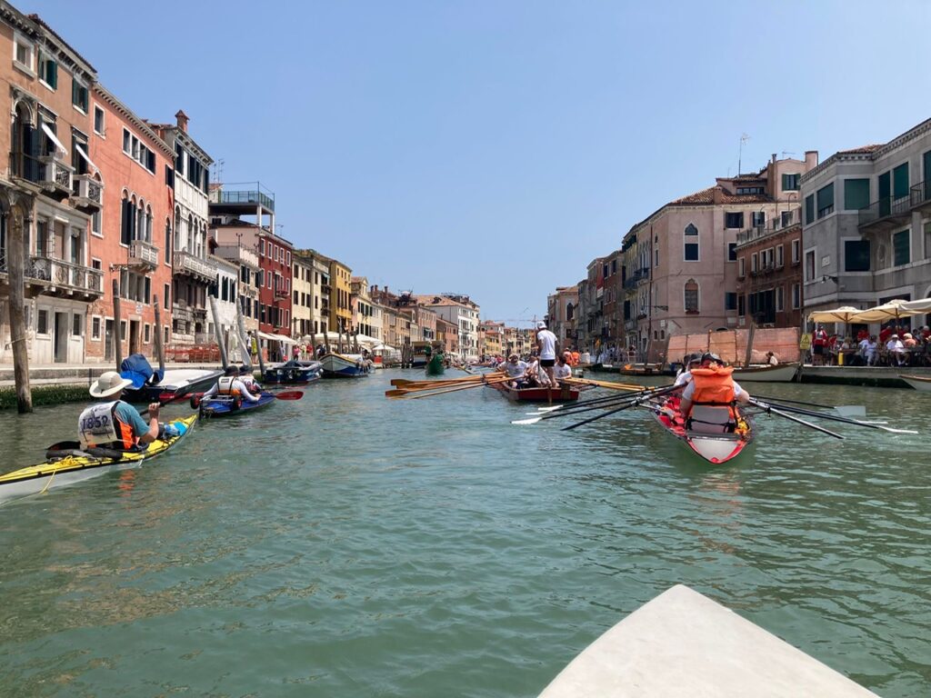 Picking up speed on a Venetian canal.