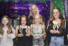 Under-11s award winners Amy Chew, Olivia Grace Williams-Canning, Paige Ryan and Ellie Gregory with coach Steph Williams-Canning. Photo: Judith Dutton.