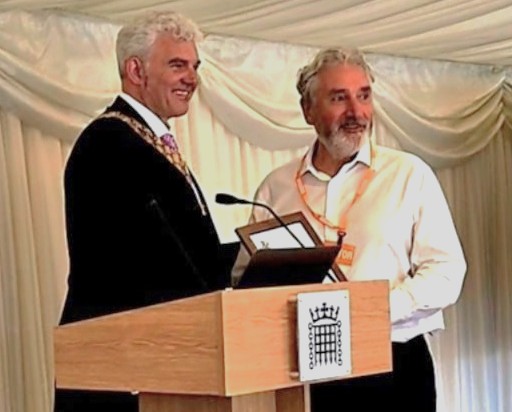 Dr Greenfield (left) presenting Brian with his award.