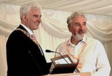 Dr Greenfield (left) presenting Brian with his award.