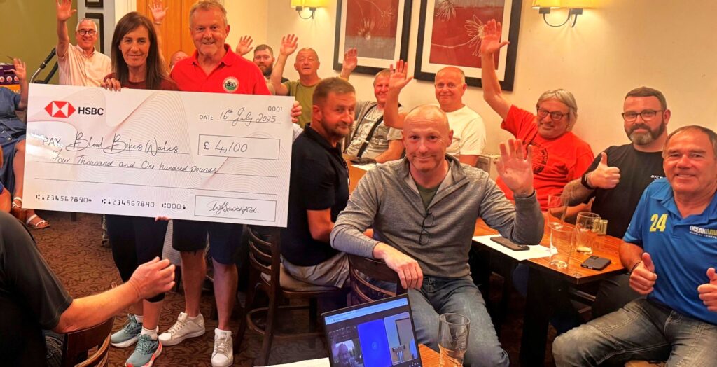 Wendy presents the cheque.