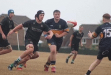 Sam Thomas bears down on the opposition full back. Photo by Judith Dutton.