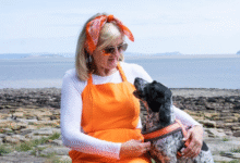 Paula Rees with her dog Pebbles on the coast at Sully.