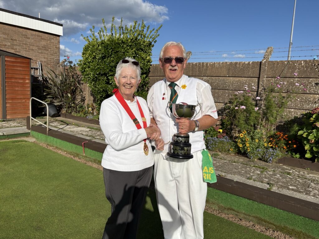 Men’s champion John Crane with Dilys Hurley.