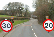 30 and 20mph signs on rural road.