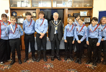 The new mayor’s Scout Troop receiving their Neckers from Cllr Dennis Clarke.