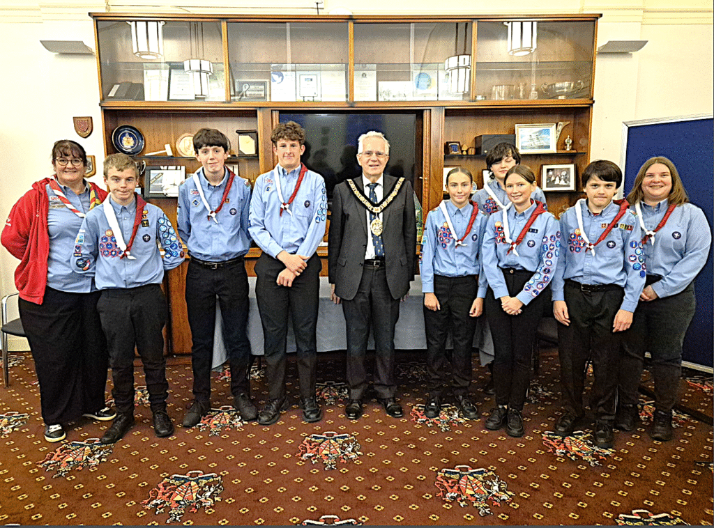 The new mayor’s Scout Troop receiving their Neckers from Cllr Dennis Clarke.
