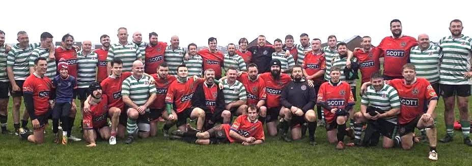 Barry and Llanelli teams get together after the game.