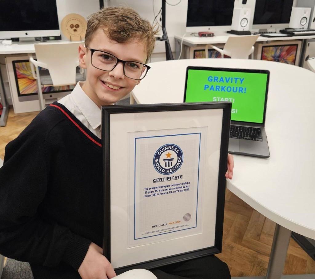 Max baker with his certificate.