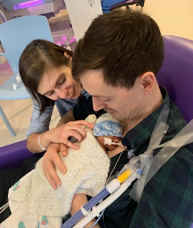 Gwenno George, baby Emrys and Luke Nicholas in the neonatal intensive care ward in Cardiff.