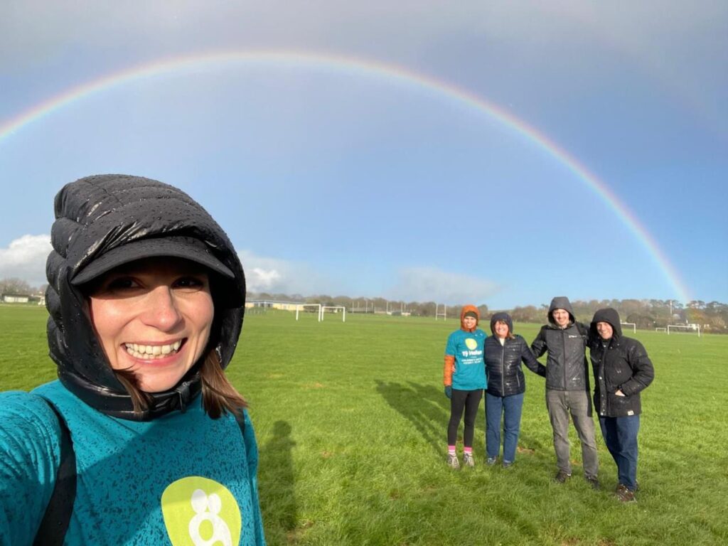 The walkers framed by Emrys’ rainbow.