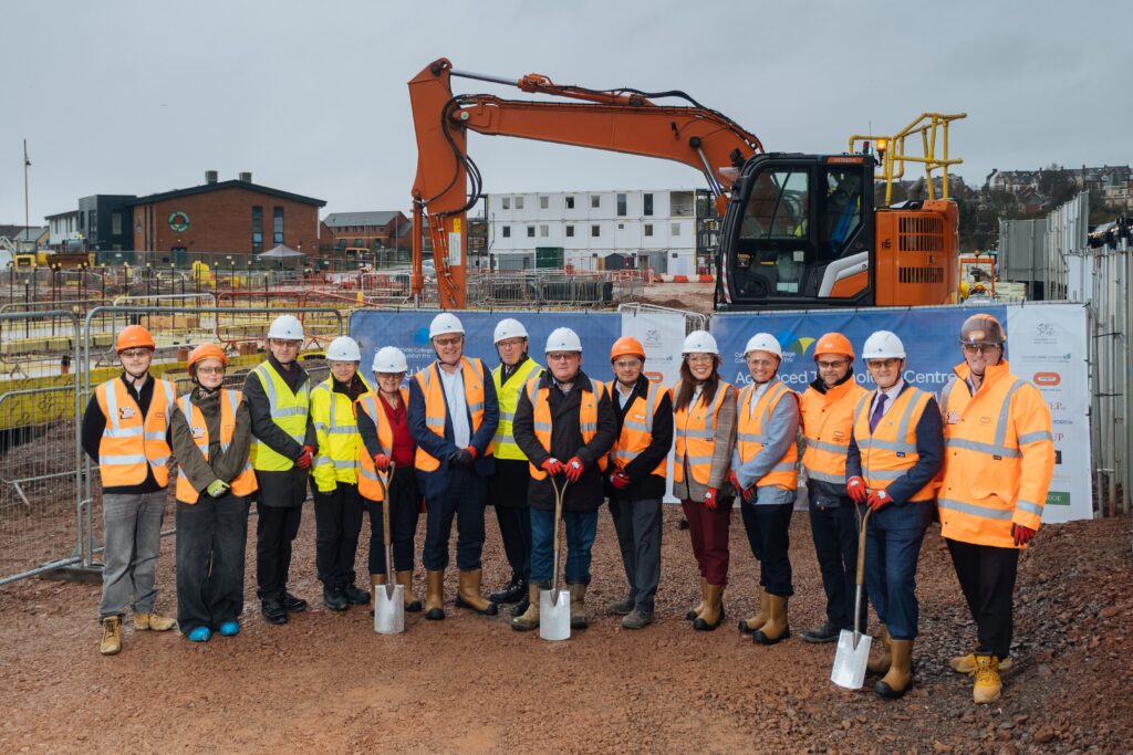 (Left to right): CAVC student ambassadors Theo Greyson-Davies and Millie Campion; Rob Thomas and Cllr Lis Burnett from the Vale Council; Jane Hutt MS; CAVC Chair of Corporation Geraint Evans; Christian Stanbury, Chief Executive WEPCo; Mike James of CAVC; Mark Cesenek, Bouygues UK; CAVC Principal Sharon James-Evans; CAVC Chief Operating Officer Richard Pugsley; Kevin McElroy, Operations Director Bouygues UK; Neal O’Leary, Welsh Government’s Sustainable Communities for Learning; and Brian Morris, Commercial Director Bouygues UK.