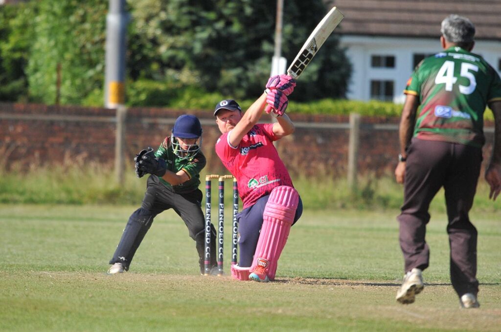 Captain James Smith goes for a big hit.