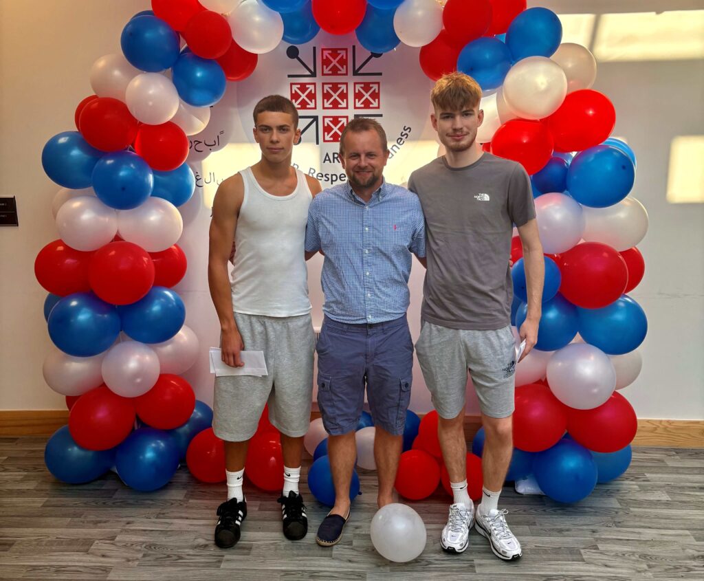 Matthew Bramhall and Alex Robson with sixth form director Rob Jones.