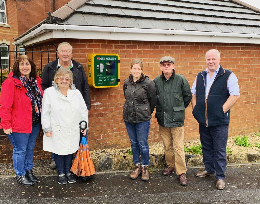 Andrew RT Davies and local residents in Rhoose with a defibrillator he funded through his CEF in 2019.