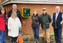 Andrew RT Davies and local residents in Rhoose with a defibrillator he funded through his CEF in 2019.