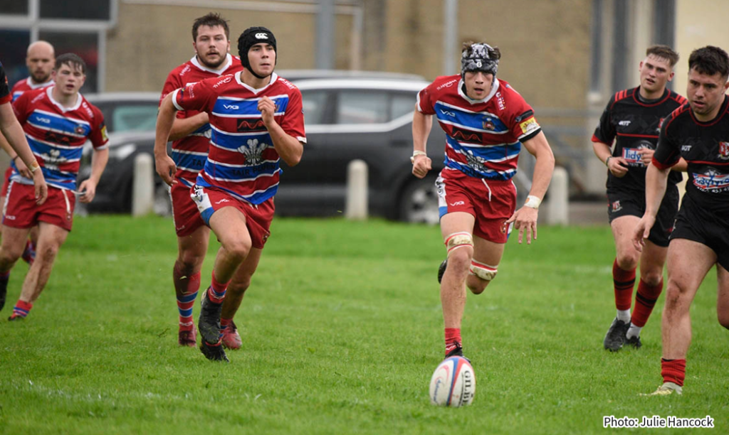 Rhys Anthony and Sam Coates pursue a loose ball.