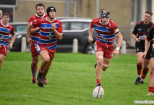 Rhys Anthony and Sam Coates pursue a loose ball.