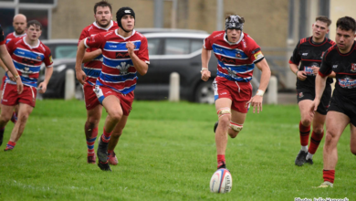 Rhys Anthony and Sam Coates pursue a loose ball.