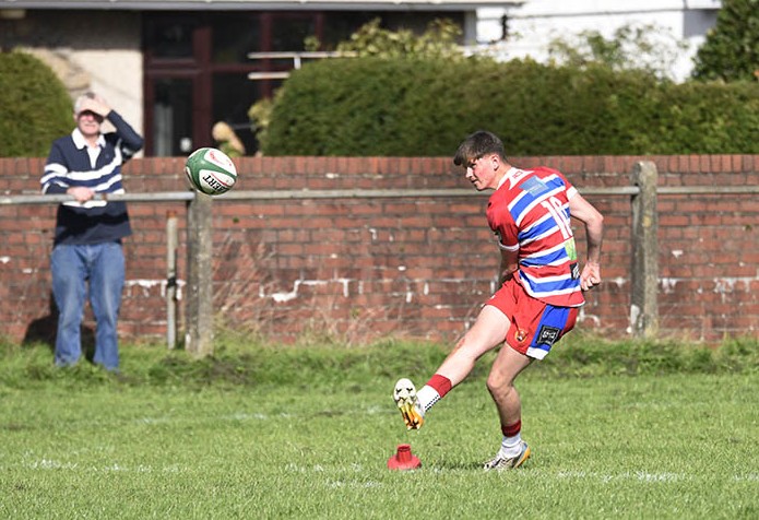 Kieran Jones kicking for Pencoed Youth. Photo: Julie Kancock.